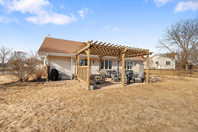 rear view of property with fence, a chimney, a yard, a patio area, and a pergola