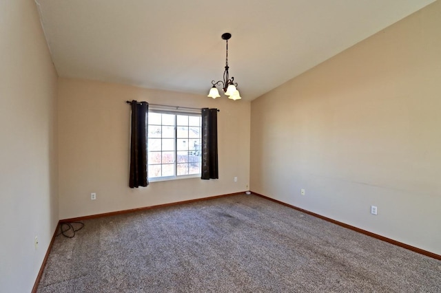 unfurnished room featuring carpet, vaulted ceiling, a notable chandelier, and baseboards