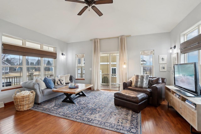 living area featuring dark wood-style floors, visible vents, a ceiling fan, and lofted ceiling