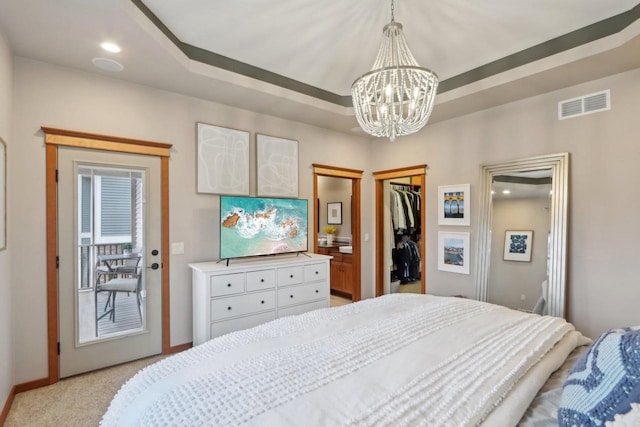 bedroom with visible vents, light carpet, recessed lighting, a raised ceiling, and a chandelier