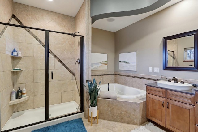 bathroom with vanity, a garden tub, a stall shower, and tile patterned flooring