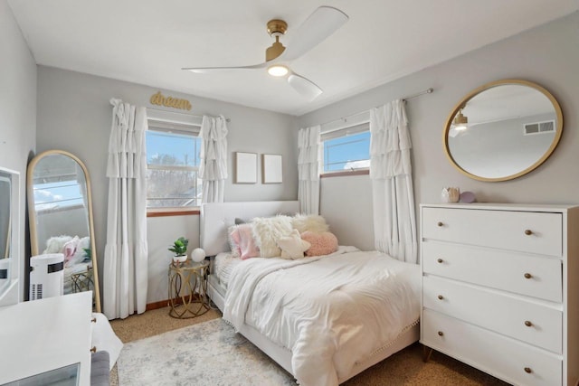 bedroom featuring visible vents and ceiling fan