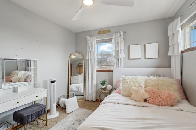 carpeted bedroom featuring a ceiling fan