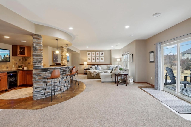 bar featuring recessed lighting, indoor wet bar, wine cooler, and carpet flooring