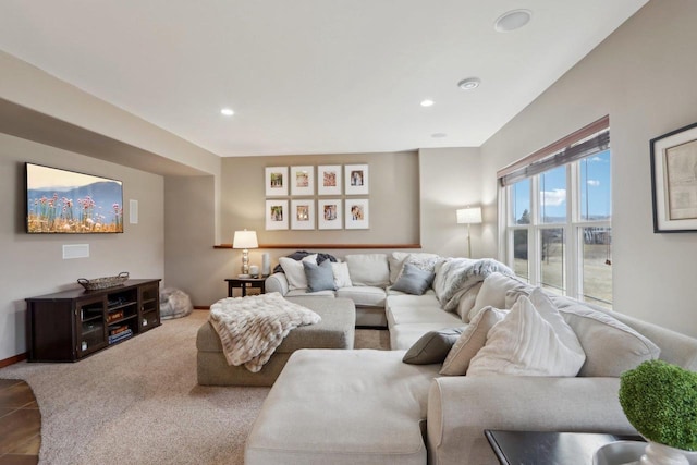 living room featuring recessed lighting, baseboards, and carpet flooring