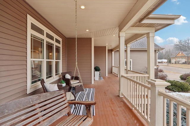 wooden terrace featuring a porch