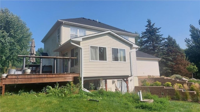 rear view of house featuring a deck