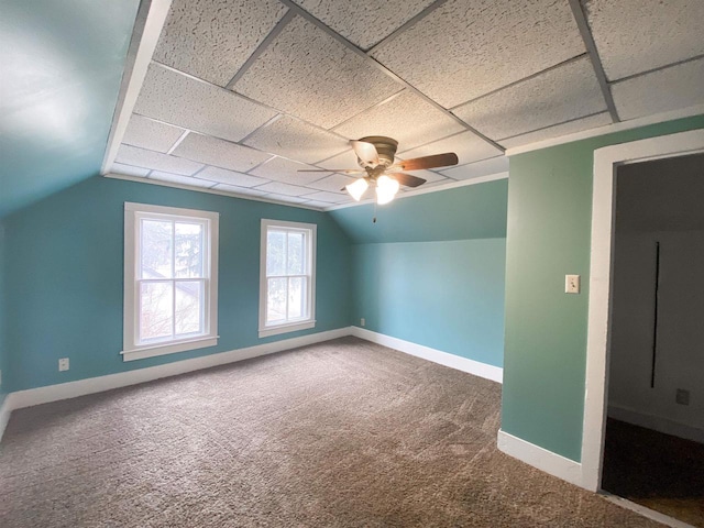 additional living space featuring ceiling fan, carpet, lofted ceiling, and baseboards