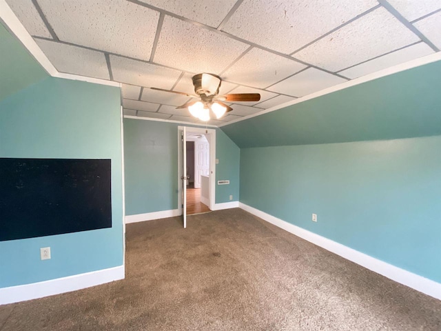 additional living space featuring ceiling fan, carpet floors, vaulted ceiling, and baseboards