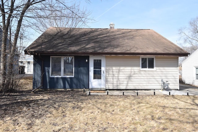 view of front of house featuring a chimney