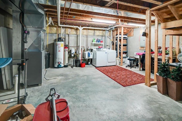 unfinished below grade area featuring washer and dryer, water heater, and a sink