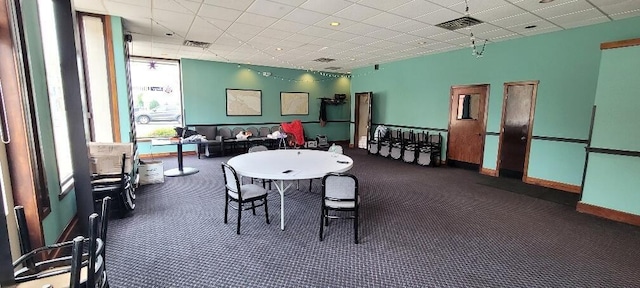 playroom with a drop ceiling, visible vents, and baseboards