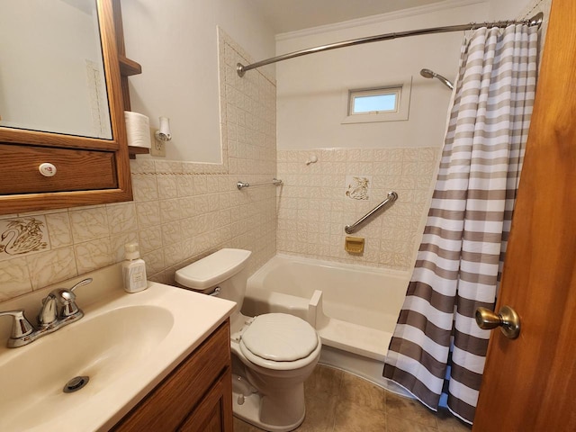 bathroom with vanity, tile walls, toilet, and tile patterned flooring