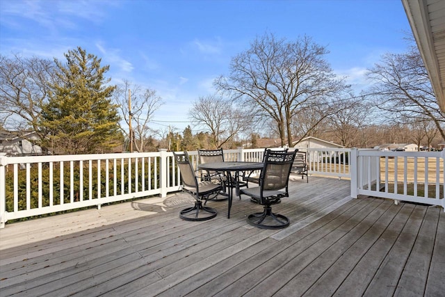 wooden deck featuring outdoor dining space