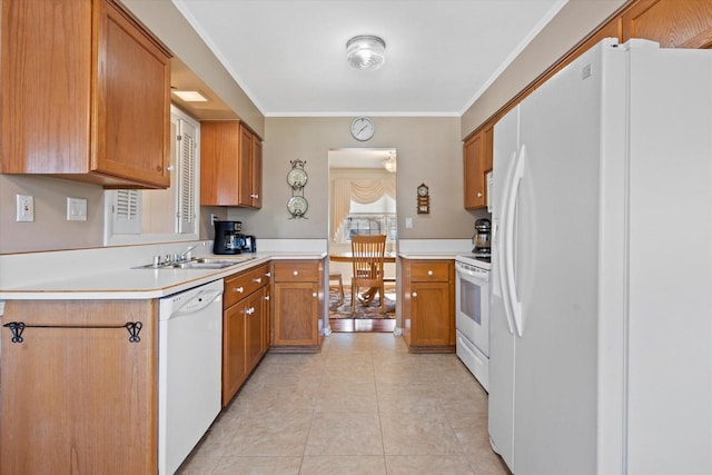 kitchen with white appliances, light tile patterned flooring, ornamental molding, a sink, and light countertops