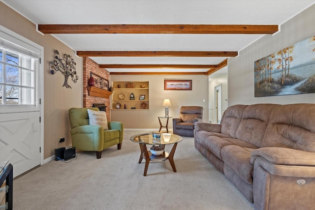 carpeted living room featuring beam ceiling and baseboards