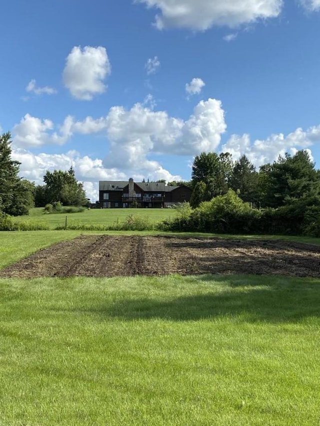 view of yard with a rural view