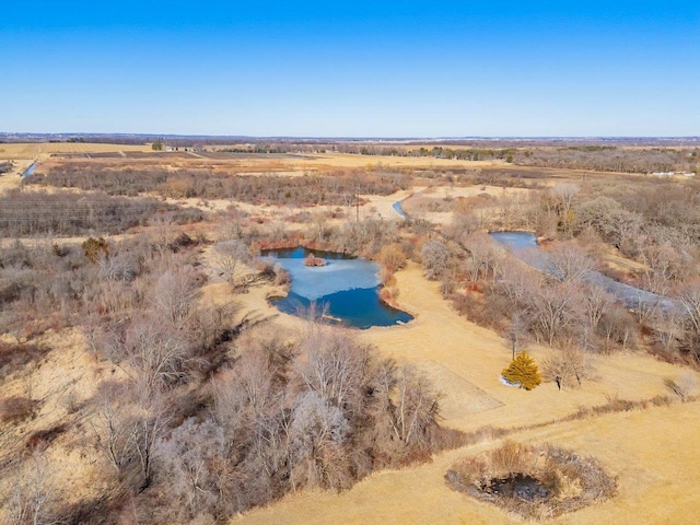 drone / aerial view featuring a water view and a rural view