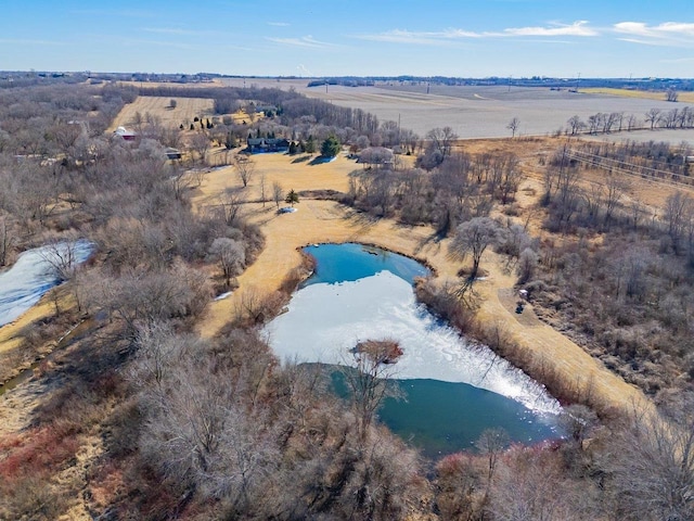 drone / aerial view featuring a water view and a rural view