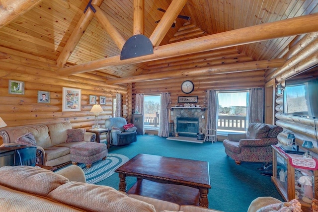 living room with carpet floors, wooden ceiling, a tile fireplace, and beam ceiling