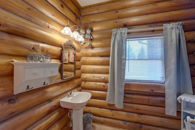 bathroom featuring rustic walls