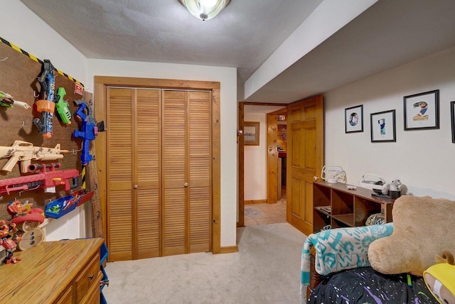 bedroom featuring a closet, carpet, and baseboards