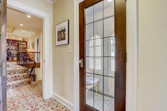 doorway featuring baseboards and recessed lighting