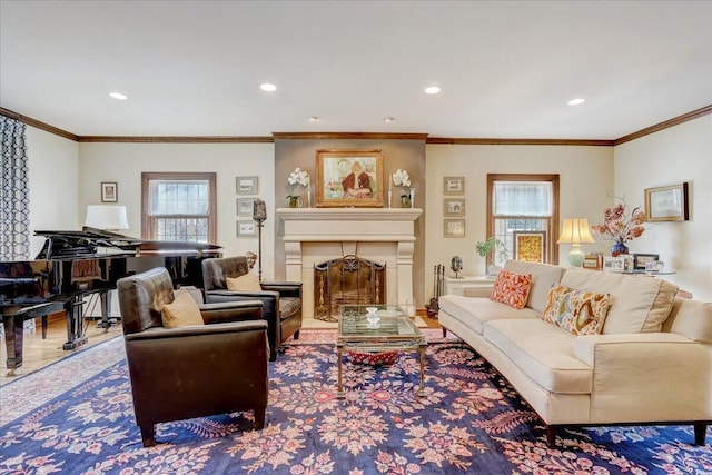 living area with ornamental molding, recessed lighting, a healthy amount of sunlight, and a fireplace