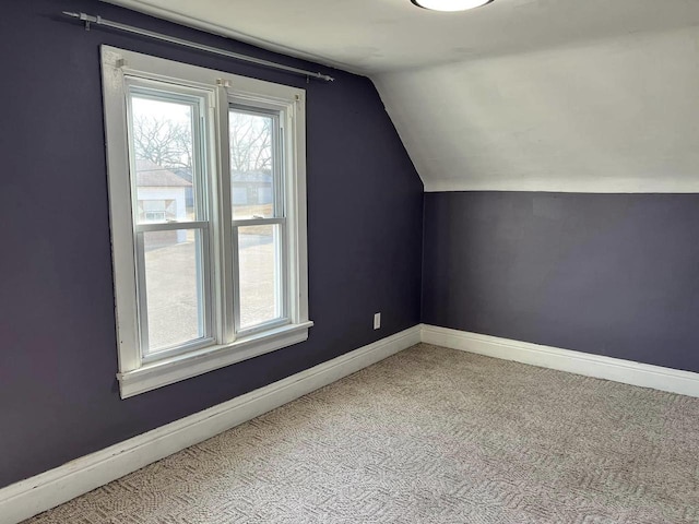 bonus room with a wealth of natural light, baseboards, carpet, and vaulted ceiling