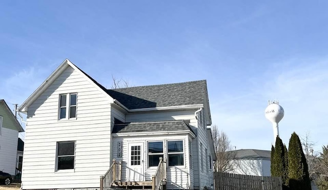 view of front of property featuring roof with shingles and entry steps