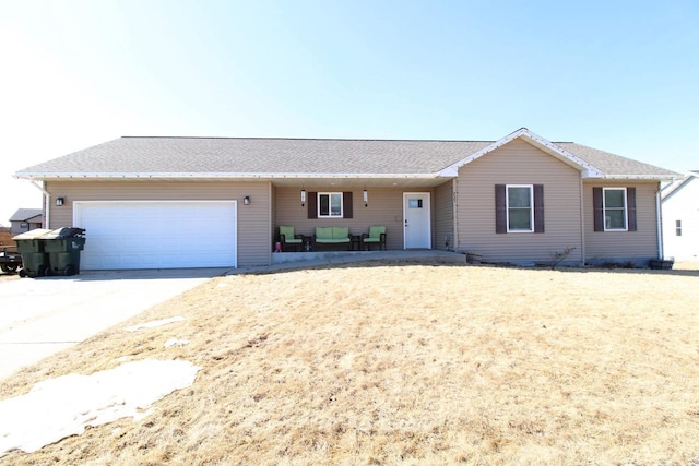 ranch-style house featuring driveway and an attached garage