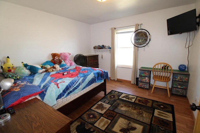 bedroom featuring wood finished floors