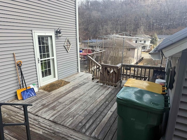 wooden deck with a forest view