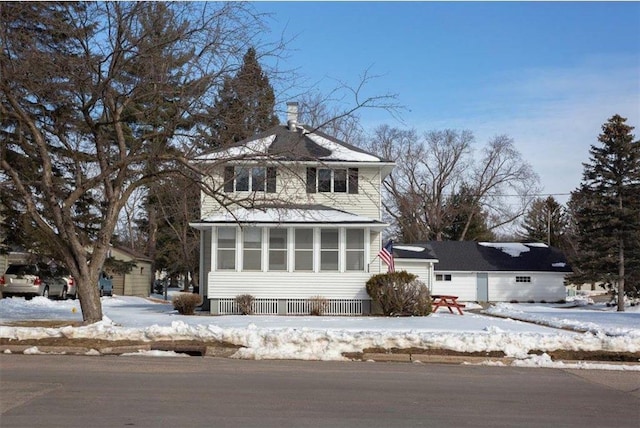 view of front facade with an outbuilding