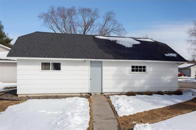 view of front facade with a shingled roof