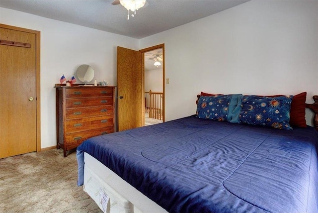 carpeted bedroom featuring a ceiling fan