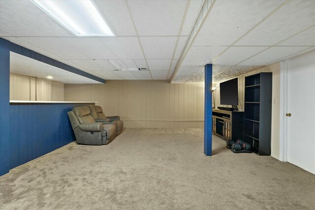 unfurnished room featuring a drop ceiling and carpet floors