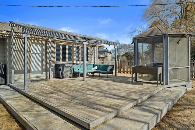 deck featuring an outdoor hangout area and fence