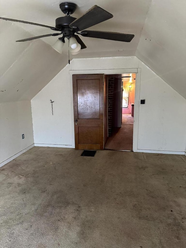 bonus room featuring carpet floors, vaulted ceiling, and a ceiling fan