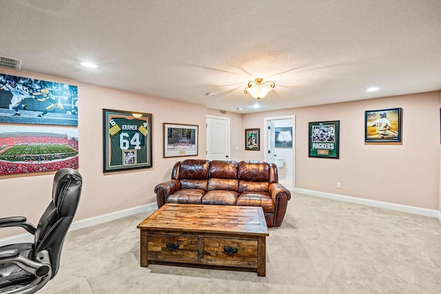 living area featuring visible vents, baseboards, light colored carpet, and a textured ceiling