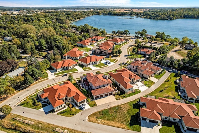 bird's eye view featuring a residential view, a view of trees, and a water view