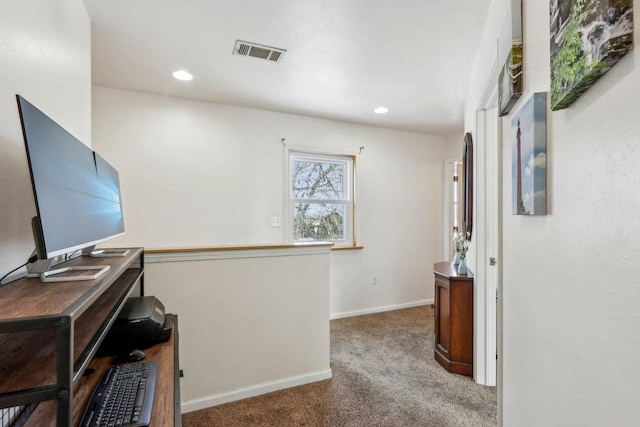 office space with carpet floors, recessed lighting, visible vents, and baseboards