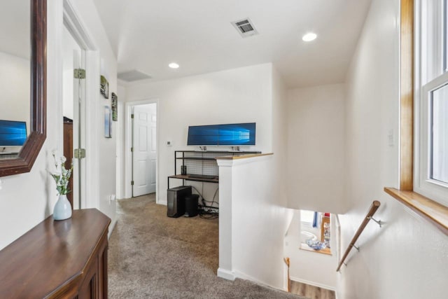 interior space featuring carpet, visible vents, and recessed lighting