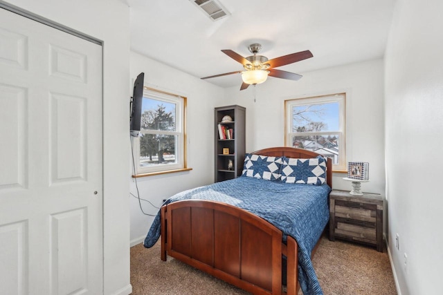 bedroom featuring carpet, visible vents, ceiling fan, and baseboards