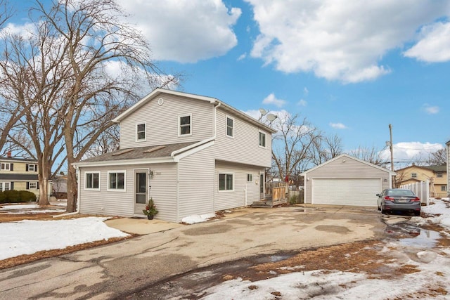 exterior space with a garage and an outdoor structure