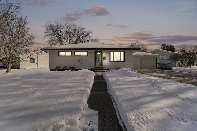 view of front of property featuring concrete driveway