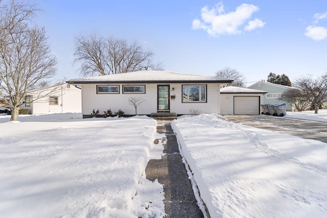 view of front of property with a detached garage