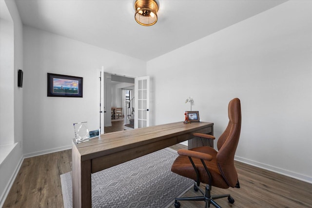 home office featuring french doors, baseboards, and wood finished floors