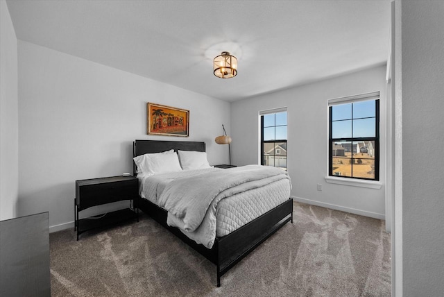 bedroom with carpet and baseboards