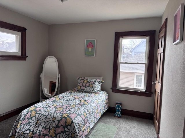 bedroom featuring carpet flooring and baseboards